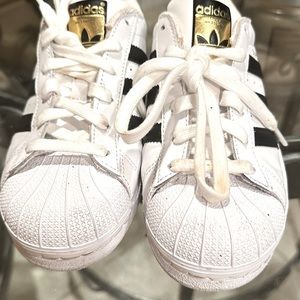 Brand New Adidas Shoe. Size 4. White and Black classic tennis shoe